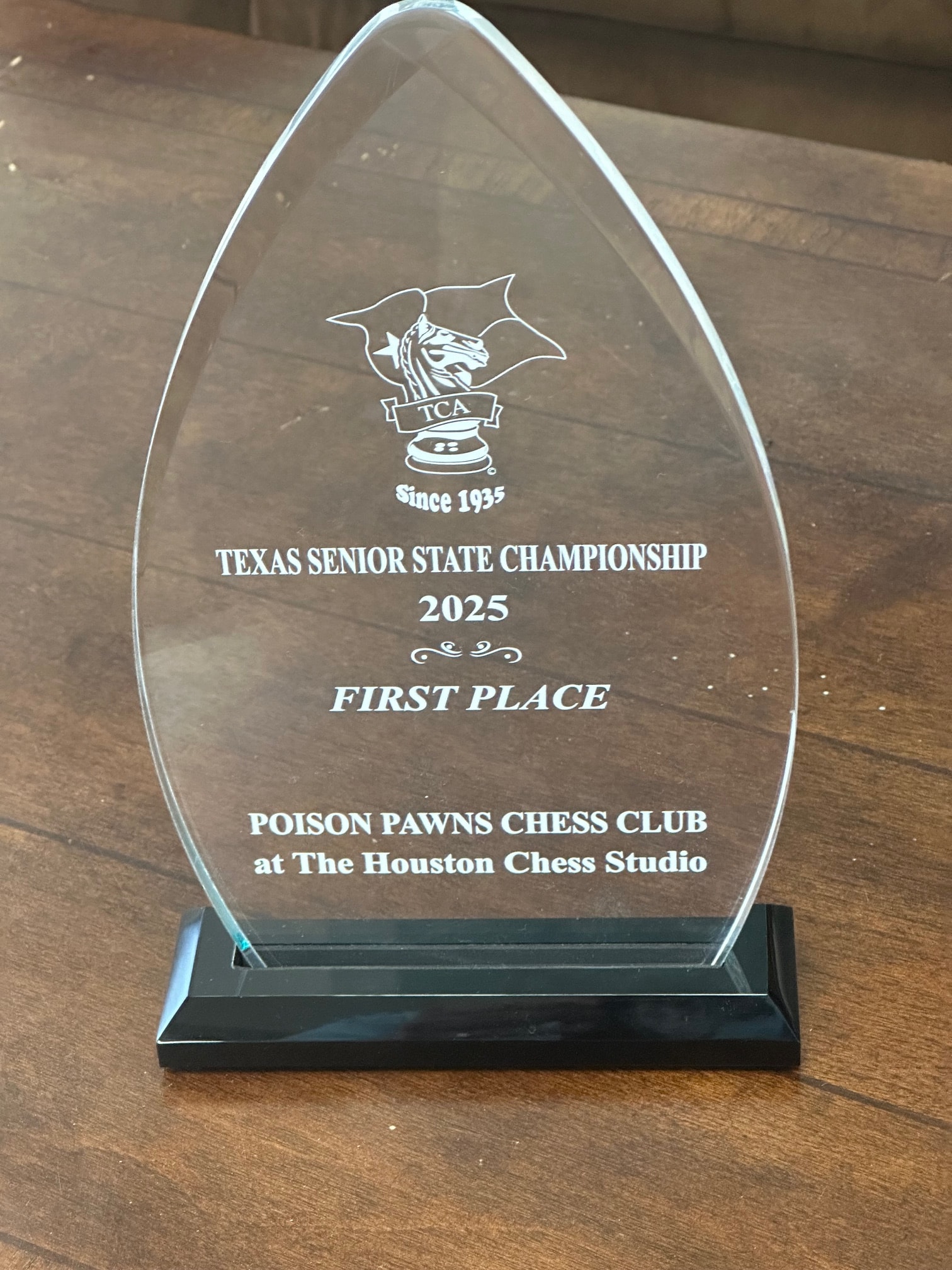 2025 Texas Senior State Championship First Place glass trophy from Poison Pawns Chess Club
